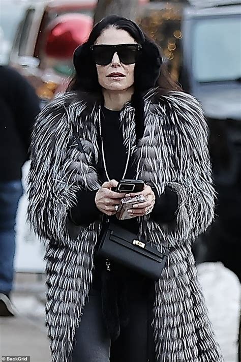 Bethenny Frankel Looks Cozy In A Stylish Coat And Ear Muffs As She Takes A Leisurely Walk By