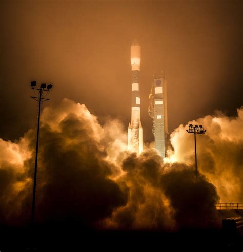 A United Launch Alliance Delta Ii Rocket Launches With The Orbiting