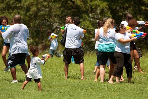 People Squirt Opponents In Group Water Gun Fight Editorial Photo