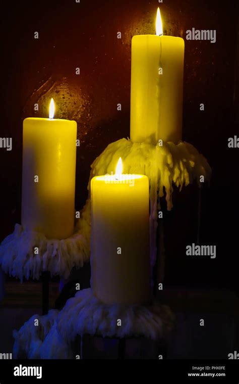 Tree Burning Candles With Wax Dripping Stock Photo Alamy