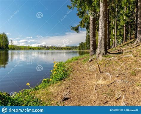 Peaceful Spring Landscape With A Clear Lake And Beautiful Reflections