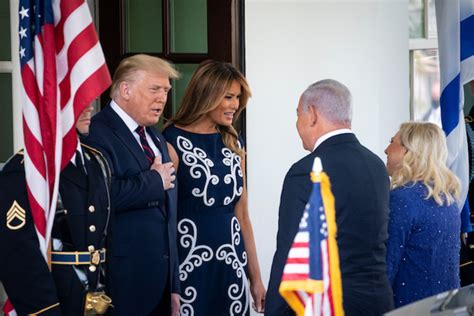 Benjamin netanyahu, prime minister of the state of israel, speaks with economic club president david m. Melania Wows In Stunning Sleeveless, Navy Blue And White ...