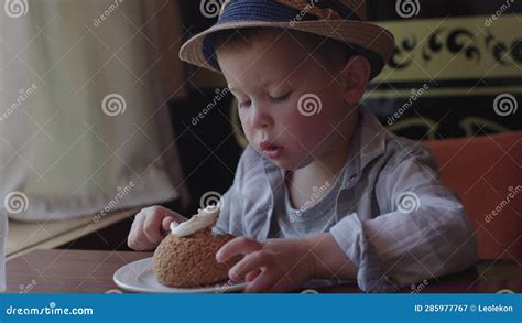 Funny Kid In Hat Enthusiasm Concentration Eats Dessert Cafe 5 Year Old