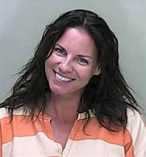 people who smiled in their mugshots