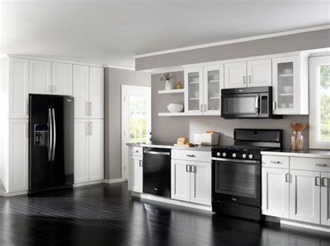 As you can see from this stylish kitchen, that couldn't be. LOVE THIS! | Black appliances kitchen, White cabinets ...