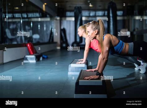Two Young Athletic Women Doing Push Ups Side View Stock Photo Alamy