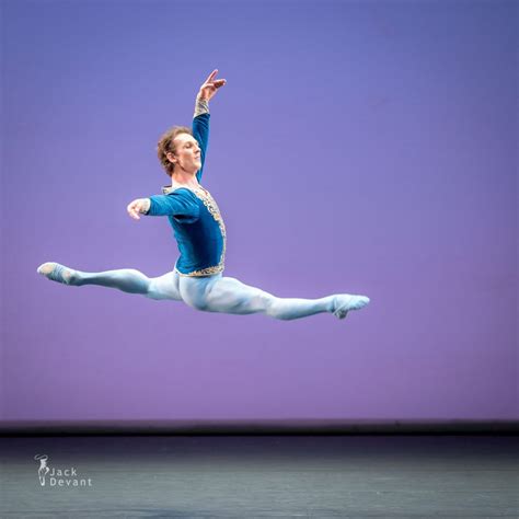 A Male Ballet Dancer In Blue Is Performing