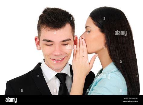 Isolated young business couple whispering Stock Photo: 54334412 - Alamy