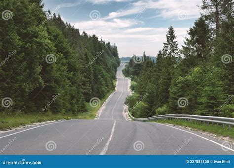 Curvy Mountain Road Serpentine In Green Summer Forest Stock Photo