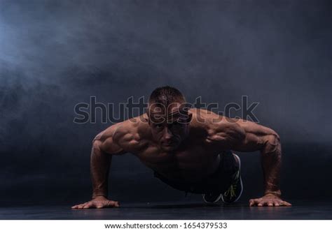 Muscular Man Doing Calisthenic Exercise Isolated Stock Photo 1654379533