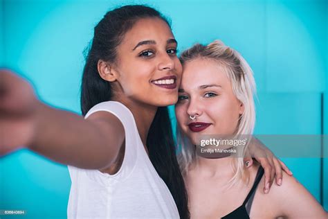 Diversity Portrait Of Two Cheerful Multi Ethnic Young Woman Taking Selfie Portrait High Res