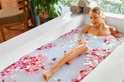 man relaxing in spa bath with flowers outdoors in day stock image image of flower freshness