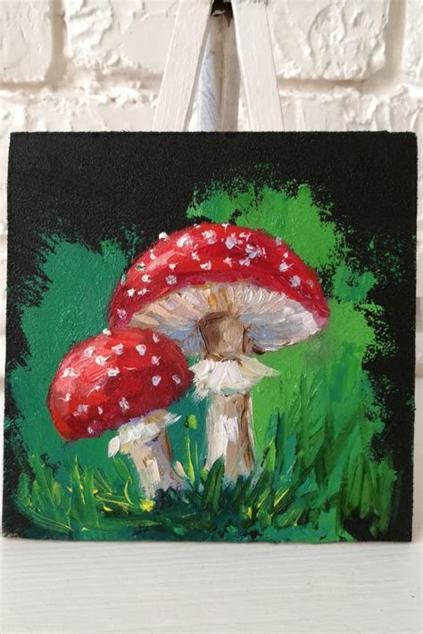 A Painting Of Two Mushrooms In The Grass