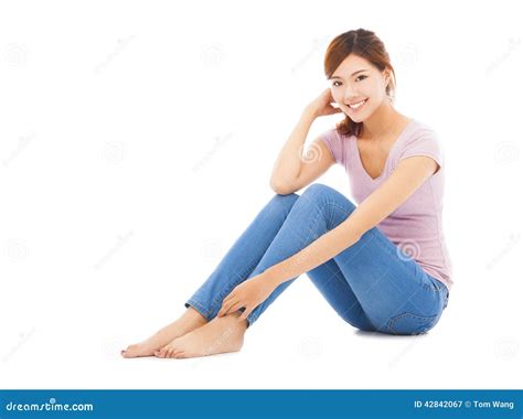 Attractive Beautiful Young Woman Sitting On The Floor Stock Photo