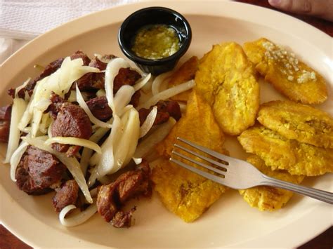 Mofongo goes well with chicken or fish broth and can be stuffed with garlic shrimp, carne frita or octopus salad. Carne Frita Con Tostones / Plantains with fried meat and ...