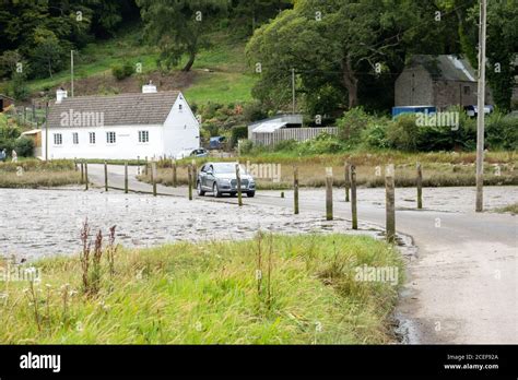 Car Driving On The Tidal Road Aveton Ford Stock Photo Alamy