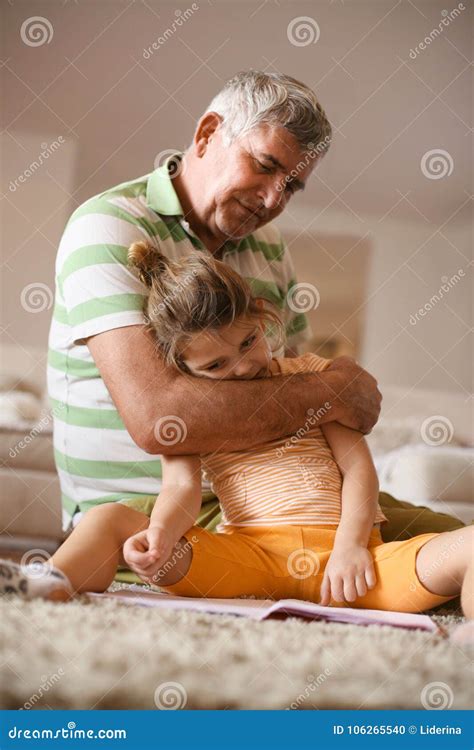 Grandfather Playing With Granddaughter On Carpet Poster Top