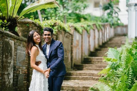 Interracial Couple Indian Man Chinese Woman Pose For Wedding