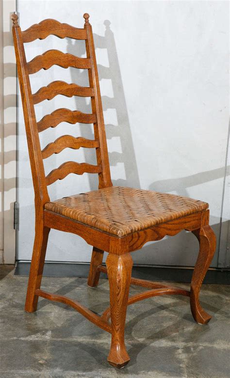 These chairs, equipped with a ladder back, are designed to be hung up when not in use. Set of 6 Ladder Back Oak Dining Chairs For Sale at 1stdibs