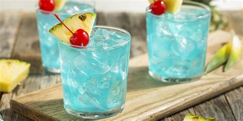 gin and blue curaçao come together in this gorgeous blue cocktail recipe — craft gin club the