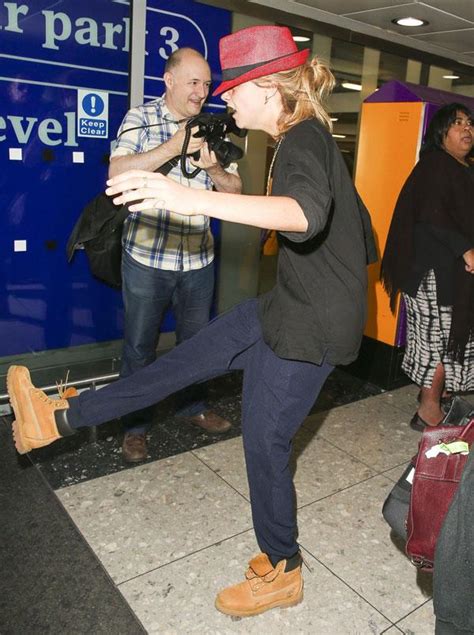 Cara Delevingne Goes Crazy At Heathrow Airport Chasing Photographers