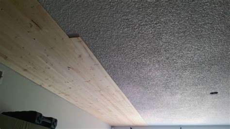 Repair / cover your popcorn ceiling in a few hours with decorative ceiling tiles. It Was Boring Popcorn Ceiling — Until He Screwed In THESE ...
