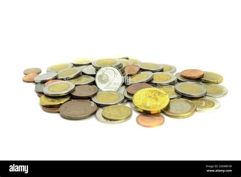 Coins Of Different Countries And Different Denominations On A White