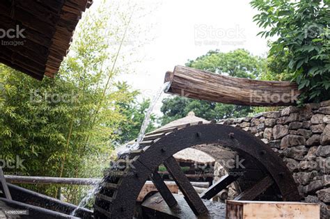 Working Watermill Wheel With Falling Water Stock Photo Download Image