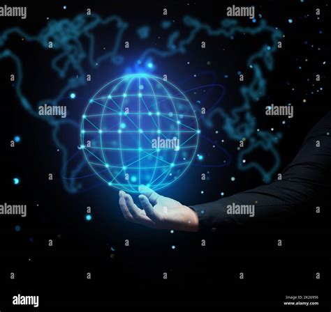 A Mans Hand Holds A Holographic Globe On A Dark Blue Background