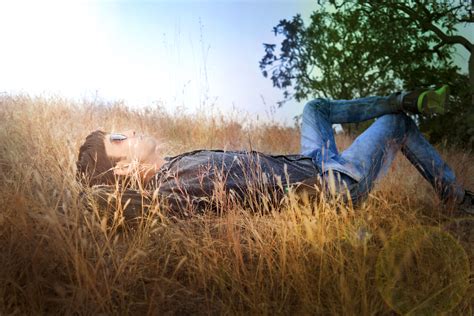 Boy Laying Down In The Sun Looking Up In The Grass Image Free Stock