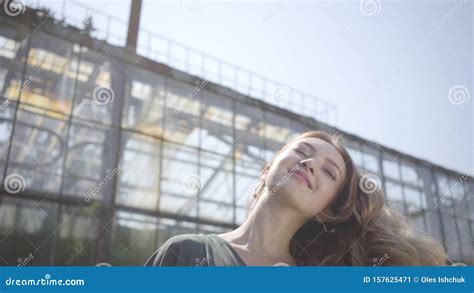 Portrait Of A Beautiful Girl Shaking Her Head With Developing Hair On A