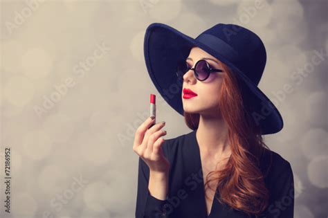 Style Redhead Women With Sunglasses And Lipstick Stock 写真 Adobe Stock
