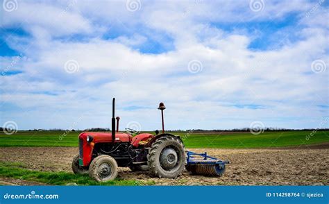 Old Tractor Work on the Field. Stock Photo - Image of machine, grass