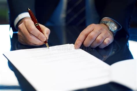 Close Up Of Businessman Signing A Contract Stock Photo Image Of