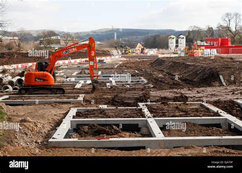 Residential construction site UK with the concrete foundations of rural
