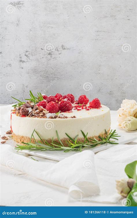 Cheesecake With Raspberries Chocolate Hazelnuts And Rosemary Leaves