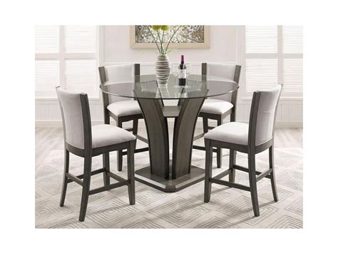 Luxurious dining room is beautifully appointed with a waterfall crystal chandelier hung over a french lacquered dining table surrounded by taupe velvet dining chairs placed on a gray hexagon rug. Gray Dining Table And Chairs / Parellen 5 Piece Dining ...