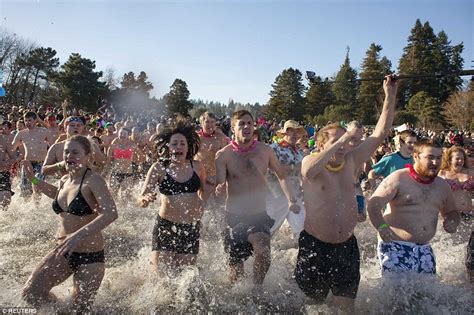 Thousands Ring In The New Year With Annual Polar Bear Plunge Tradition