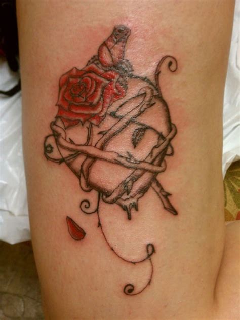 Tattoos of roses with thorns rose and thorn tattoos cool. Tattoo I did: Heart with a rose and thorns wrapped around ...