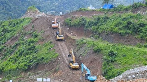 Excavator Crawling Up To The Hills On The Dam Construction Bendungan