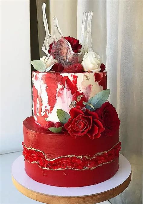 A Red And White Cake With Flowers On Top