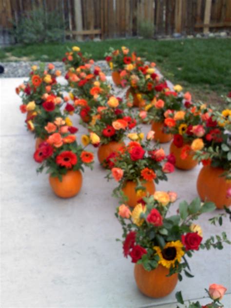 Fall is fast becoming a favorite wedding season. Table Centerpieces for fall wedding arranged in pumpkins ...