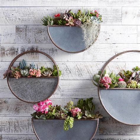 The planter features two metal pots for flowers and other plants. 31 Best Metal Wall Decor Ideas and Designs for 2020