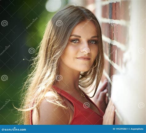 Beautiful Young Woman Poses In Fitted Orange Dress Stock Image Image