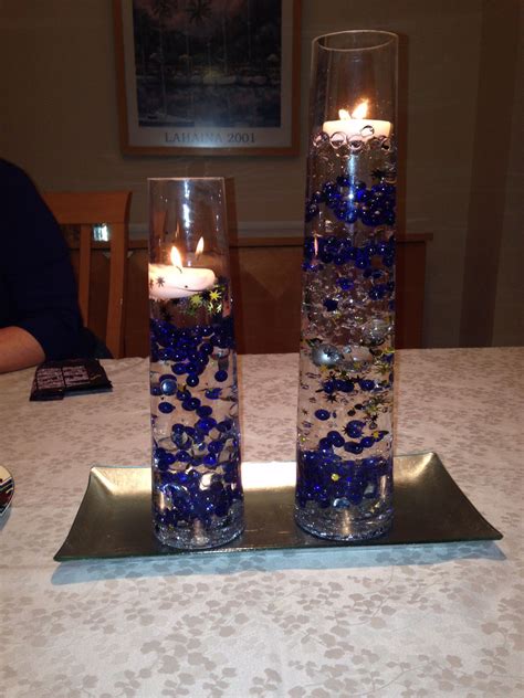 Clear Gel Beads Make Colored Glass Beads Appear Suspended In Water Top With Floating Candle