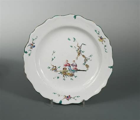 An 18th Century French Marseille Faience Plate Enamelled With Two
