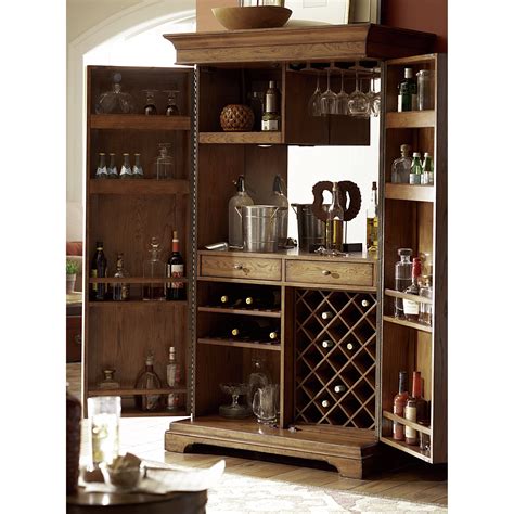 You can store wine bottles in the allotted shelves but you also generally get a. Hammary Hidden Treasures Bar Cabinet with Wine Storage ...