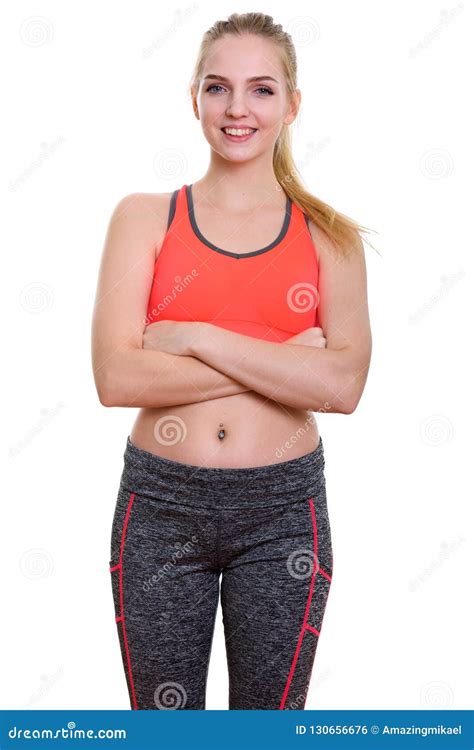 Studio Shot Of Young Happy Teenage Girl Smiling With Arms Crosse Stock