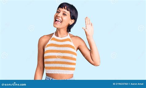 Young Brunette Woman With Short Hair Wearing Casual Clothes Waiving