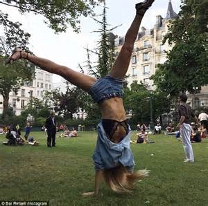 Bar Refaeli Flashes Her Lace Bra And Toned Tummy In Parisian Park